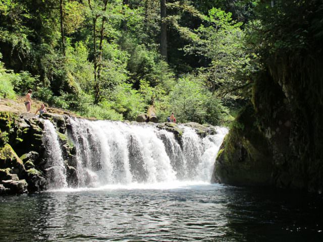 people swimming at Lower Punch Bowl Falls