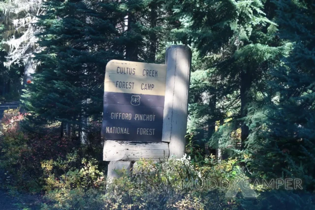 a sign in the woods